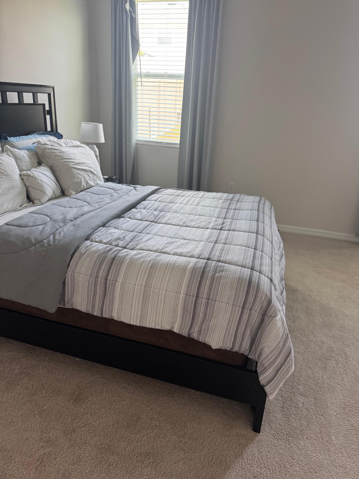 Neatly made guest bedroom